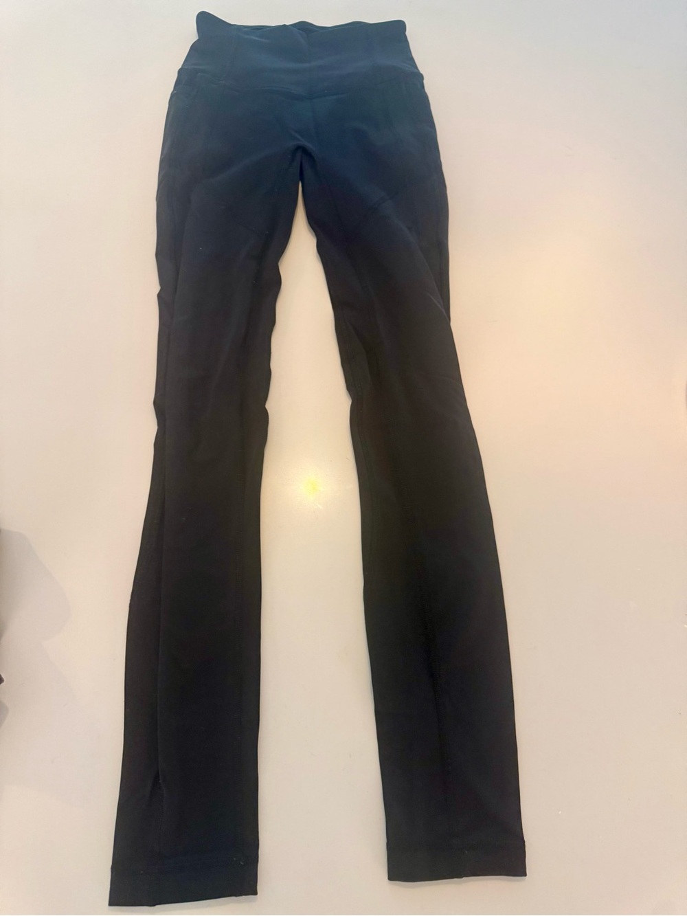 Lululemon Black Women’s High-Waist Straight-Leg Pants (with side pockets).